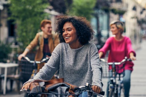Photograph of people bicycling